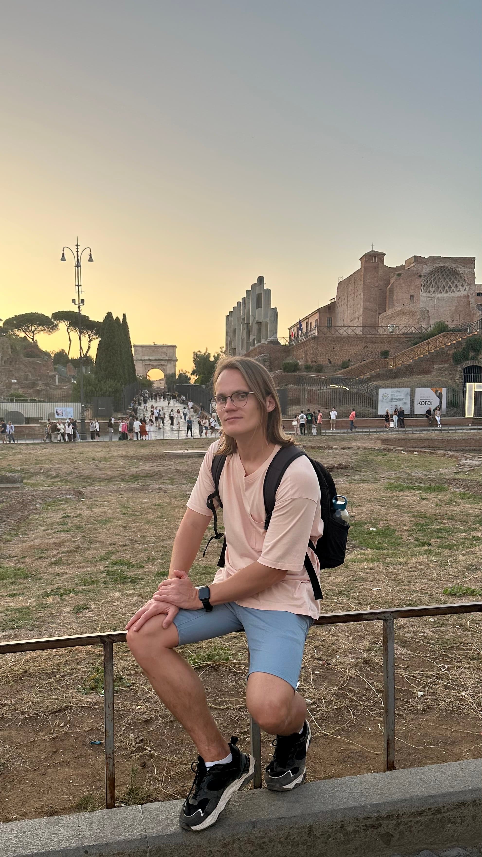 Me sitting in front of Colosseum in Rome, Italy